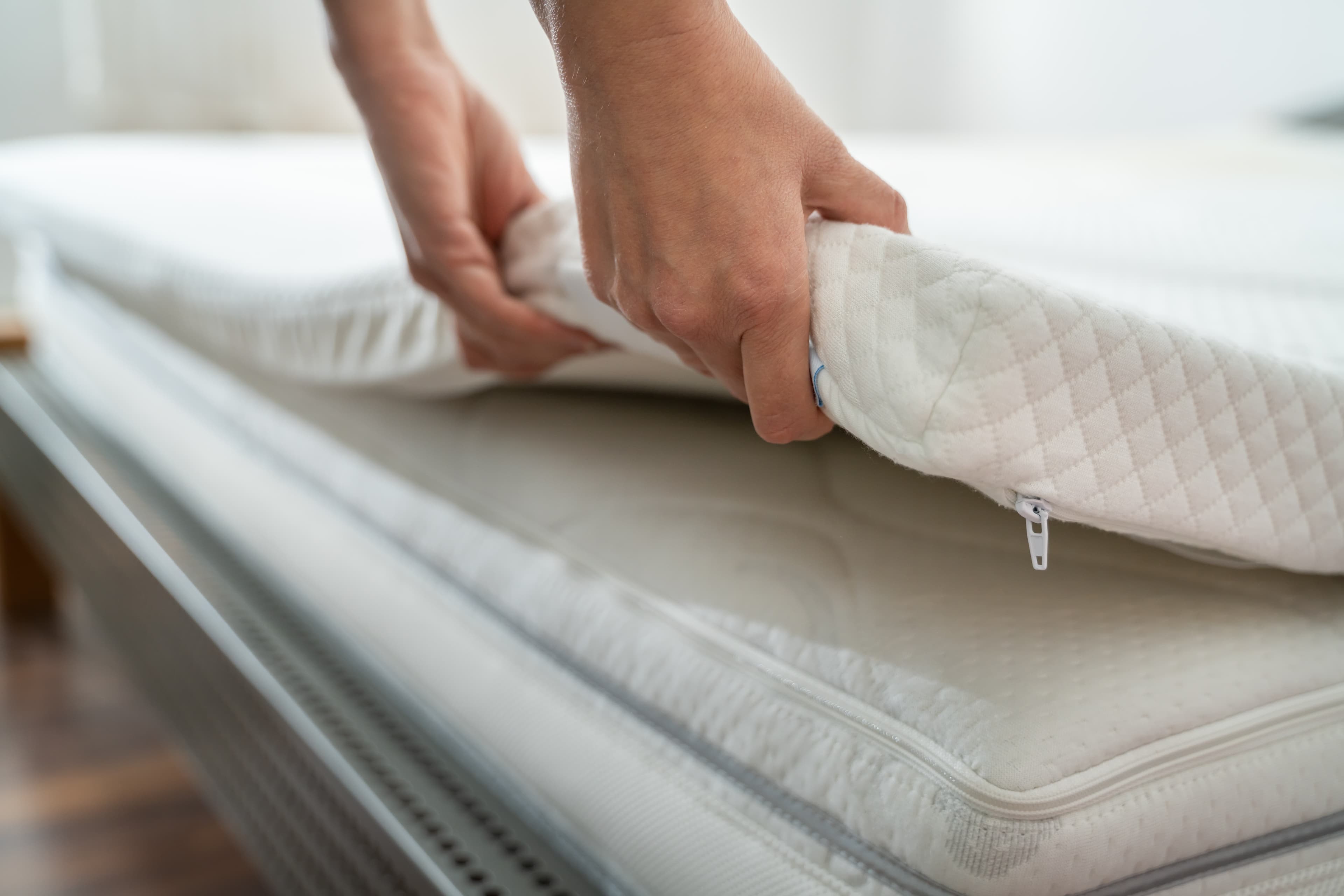 Putting down the Leesa Mattress Topper