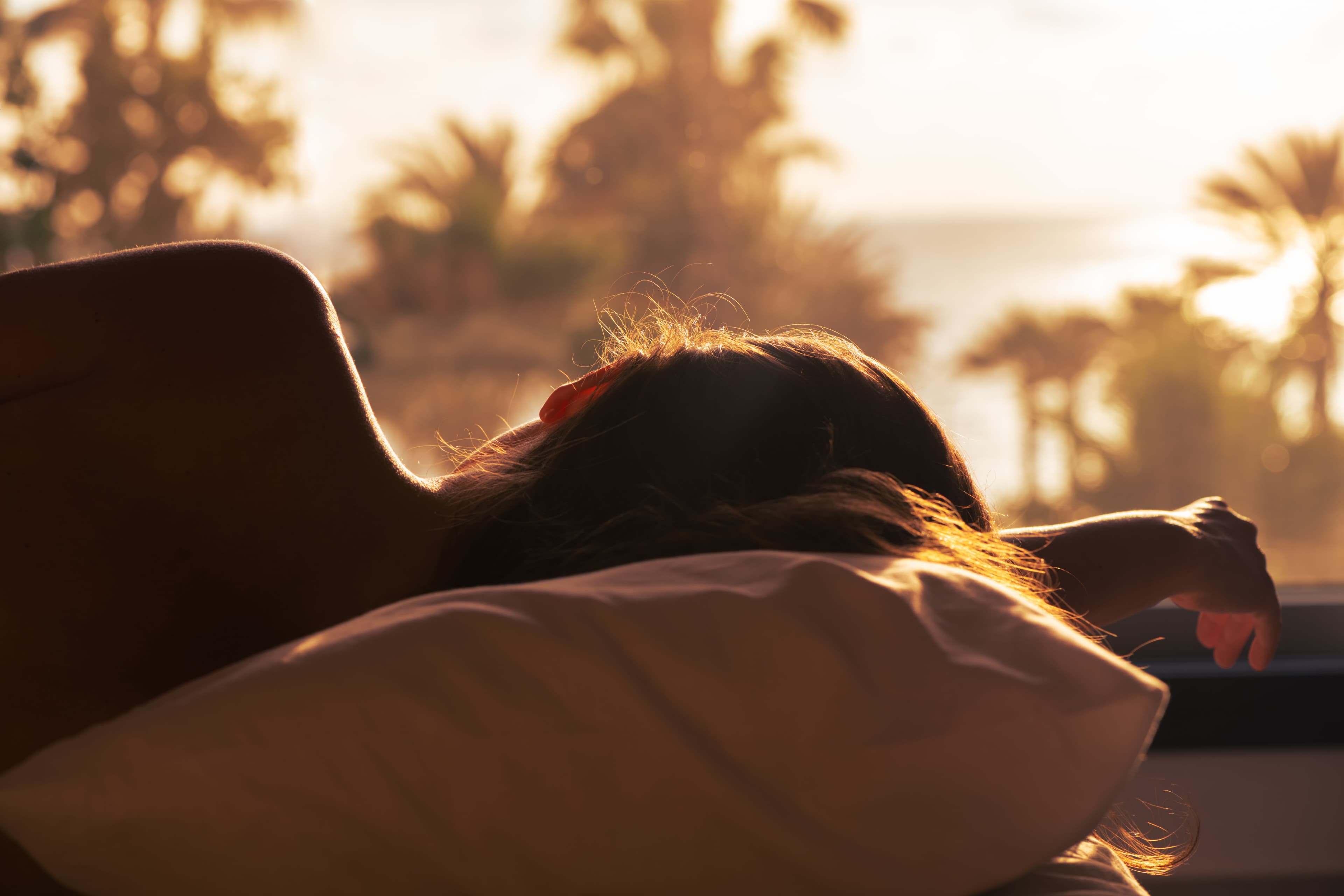 A woman sleeping on her side on a Leesa