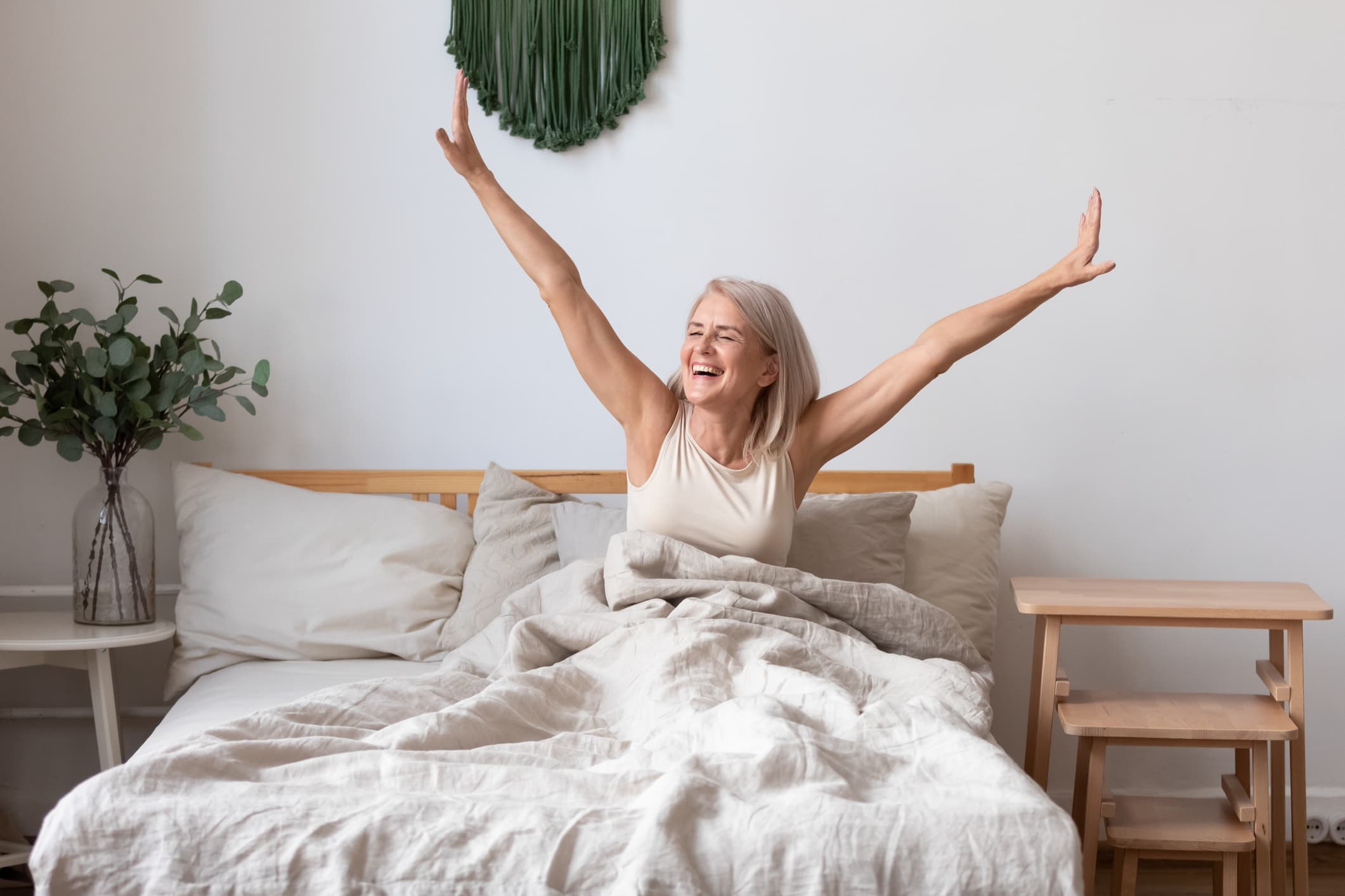 A woman waking up on her Leesa mattress