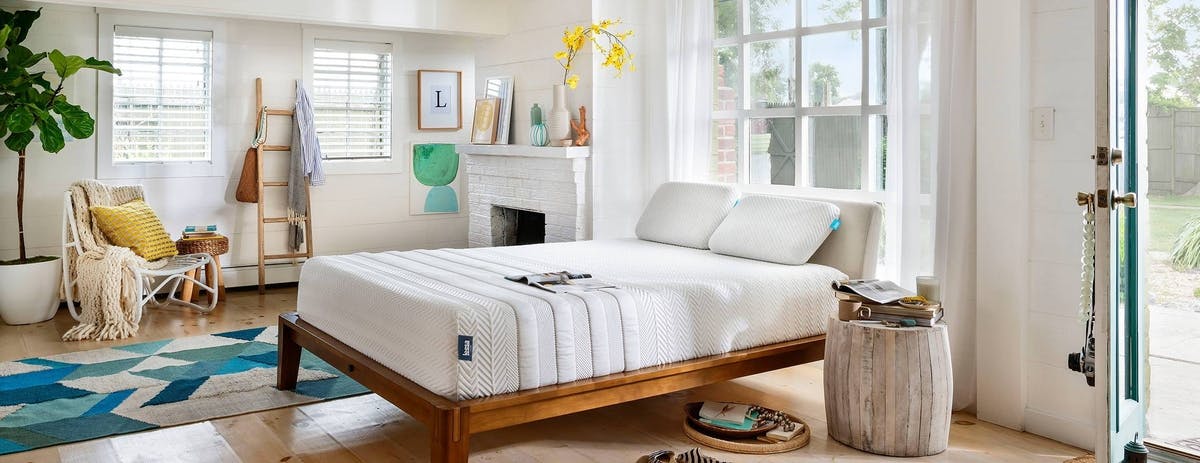 white_leesa_mattress_in_decorated_room_open_door_outside_view