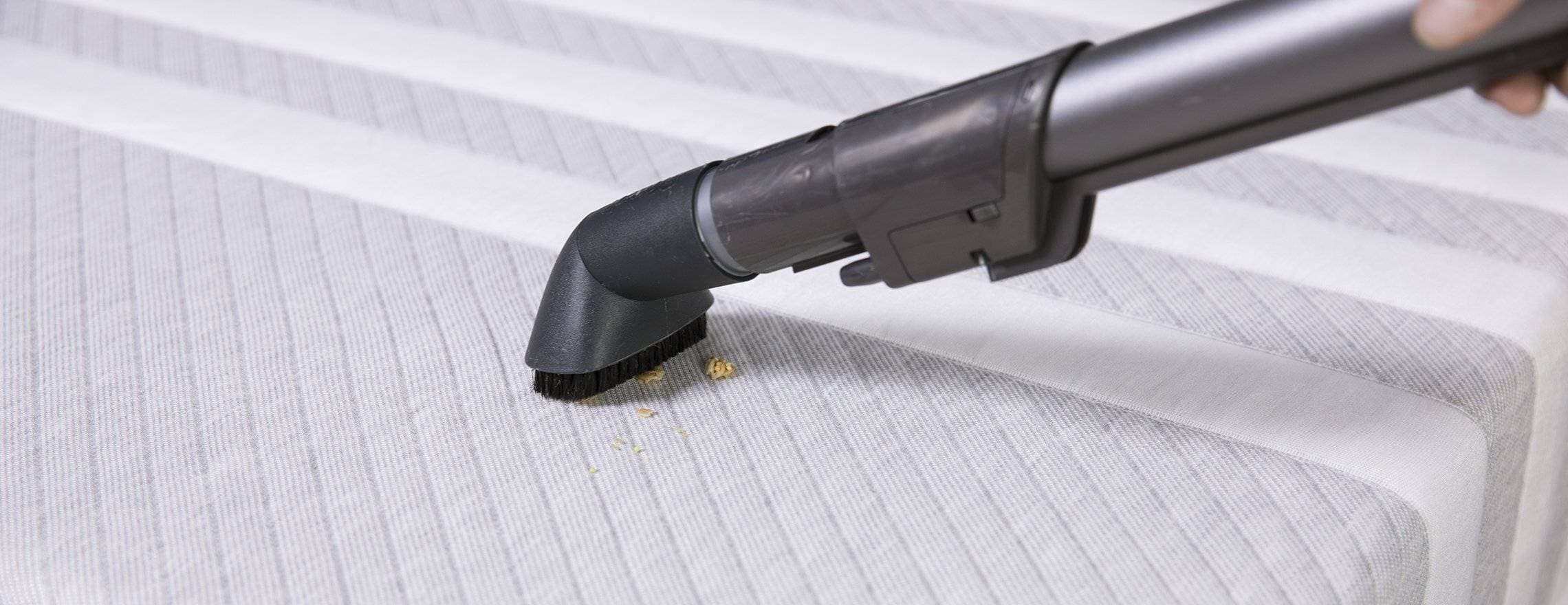 Vacuuming dirt off a Leesa