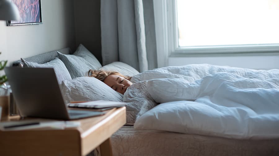 remote-worker-sleeping on mattress.webp