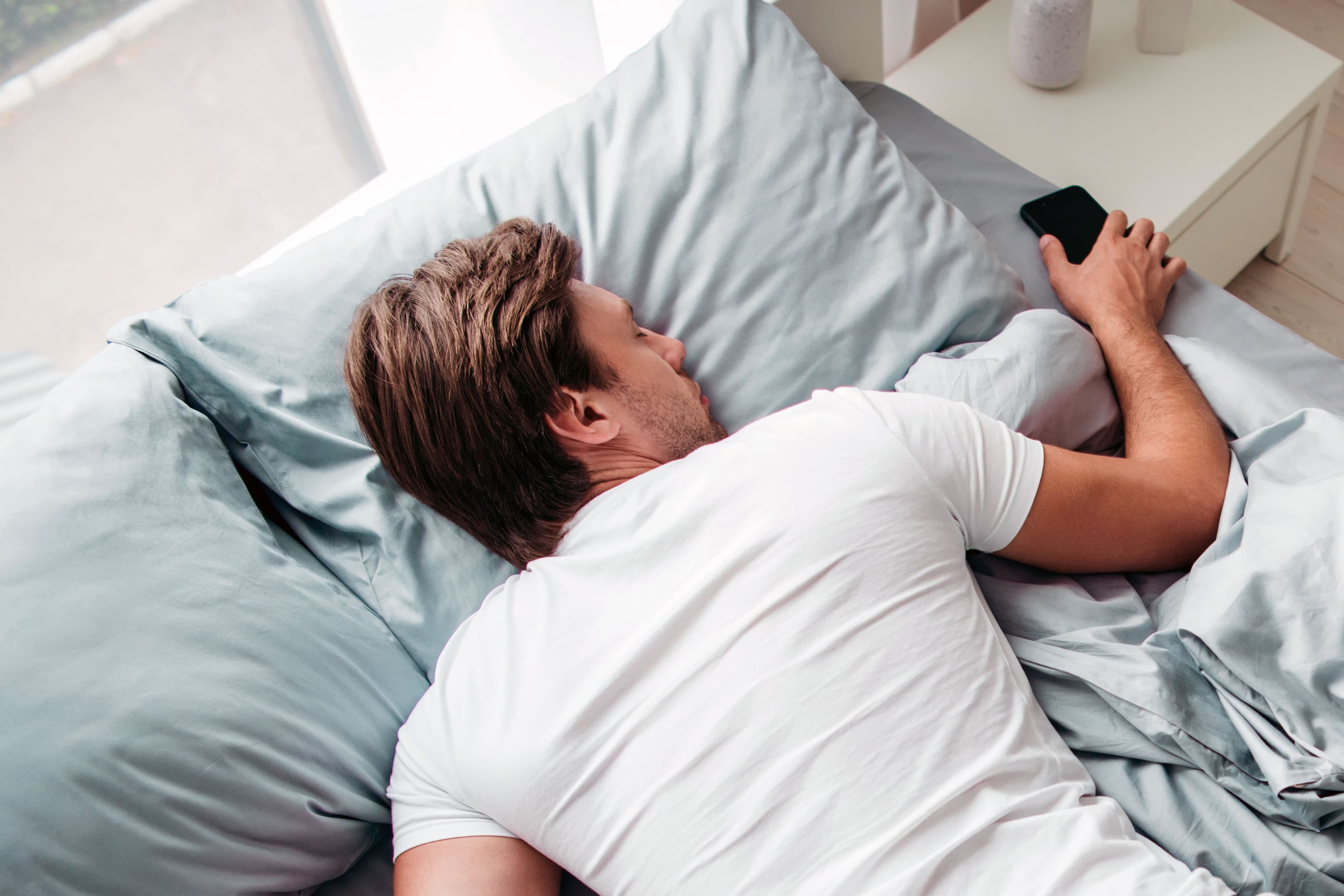Man sleeping on a Leesa bed