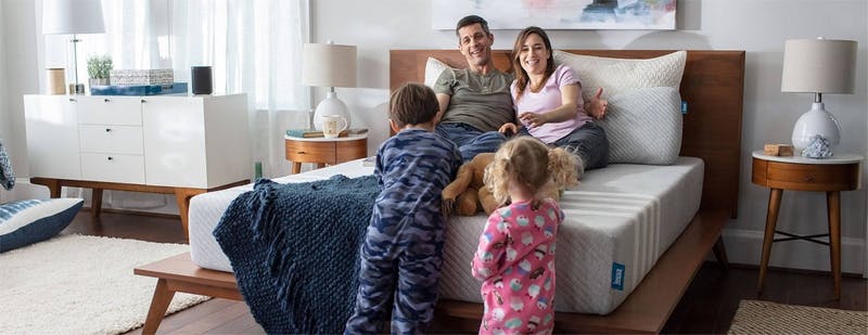 family_together_on_a_leesa_mattress_in_a_decorated_bedroom