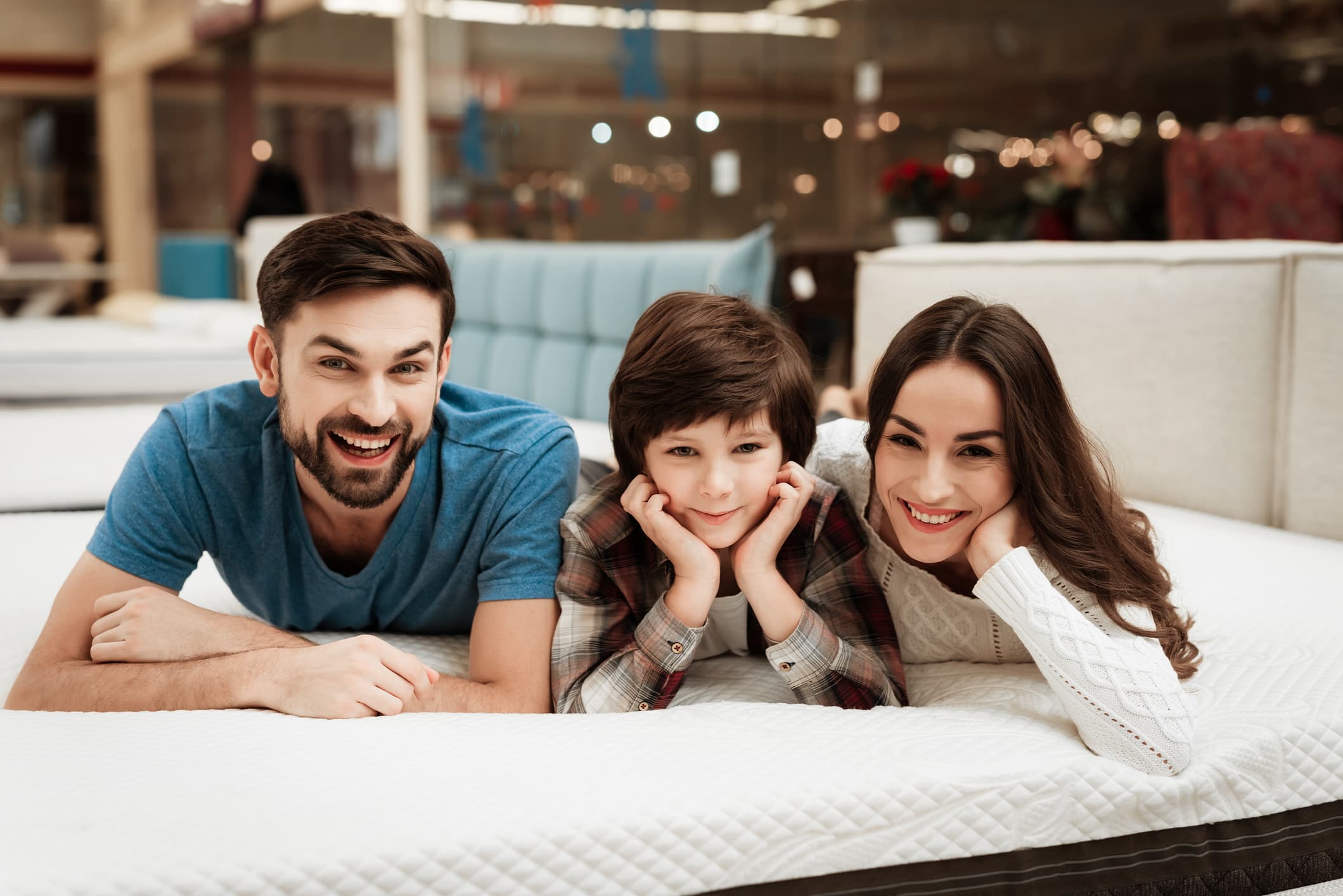 A couple with their child on a Leesa mattress