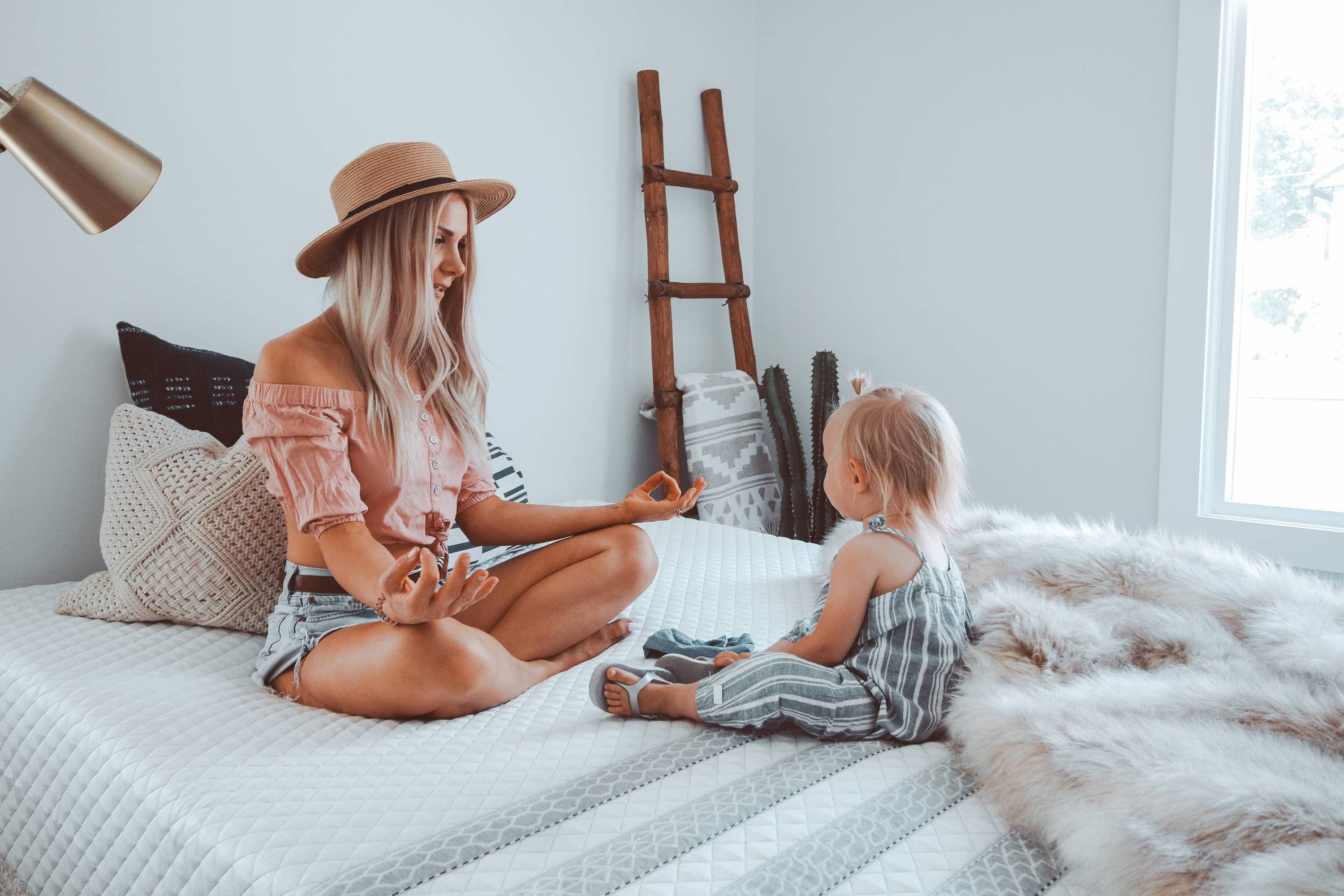 A mother meditating on a Leesa mattress