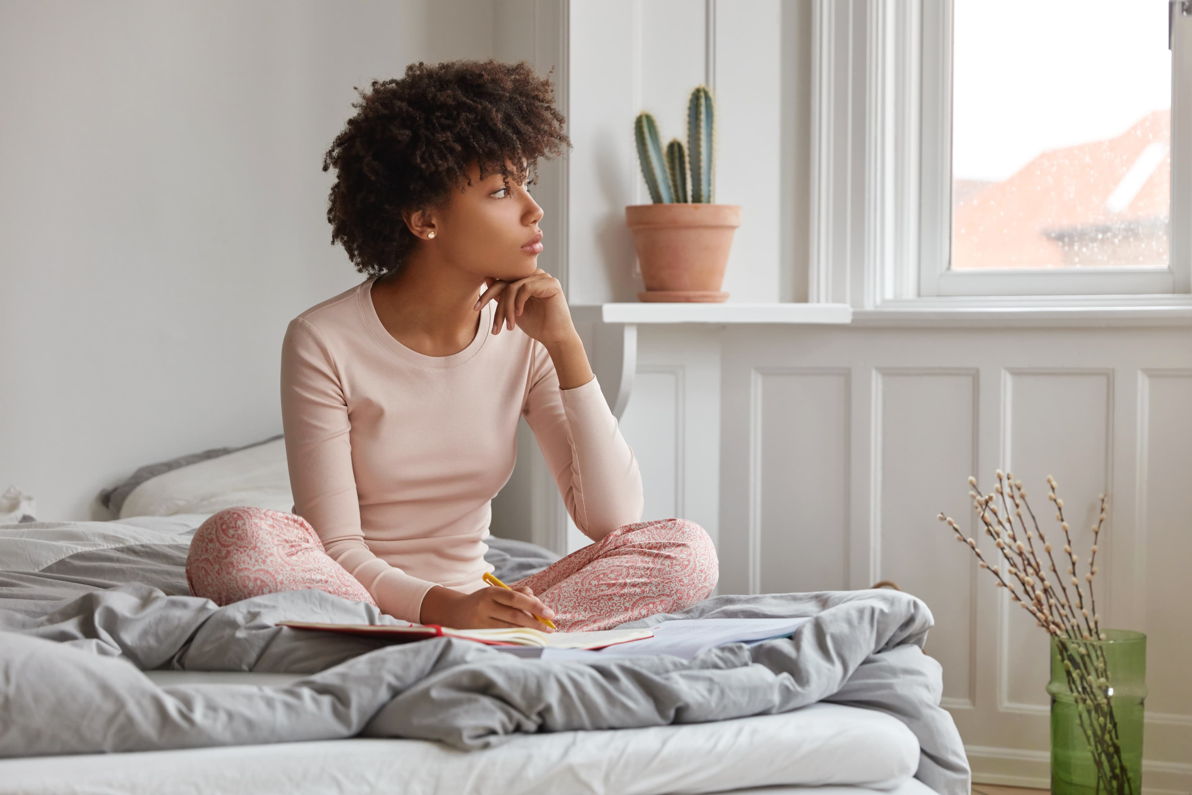Woman sitting on a Leesa mattress
