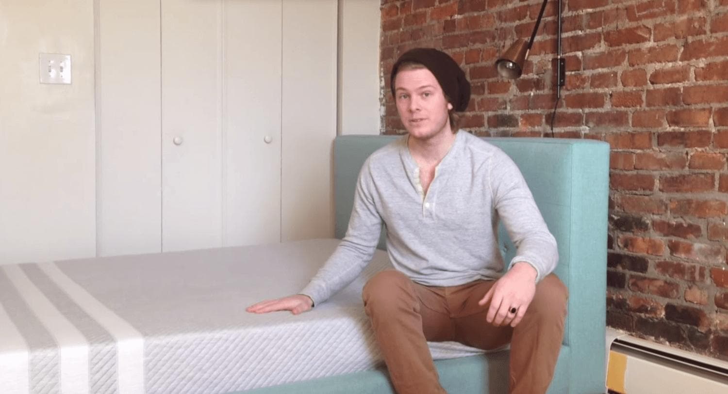 man_sitting_on_a_leesa_mattress.jpg