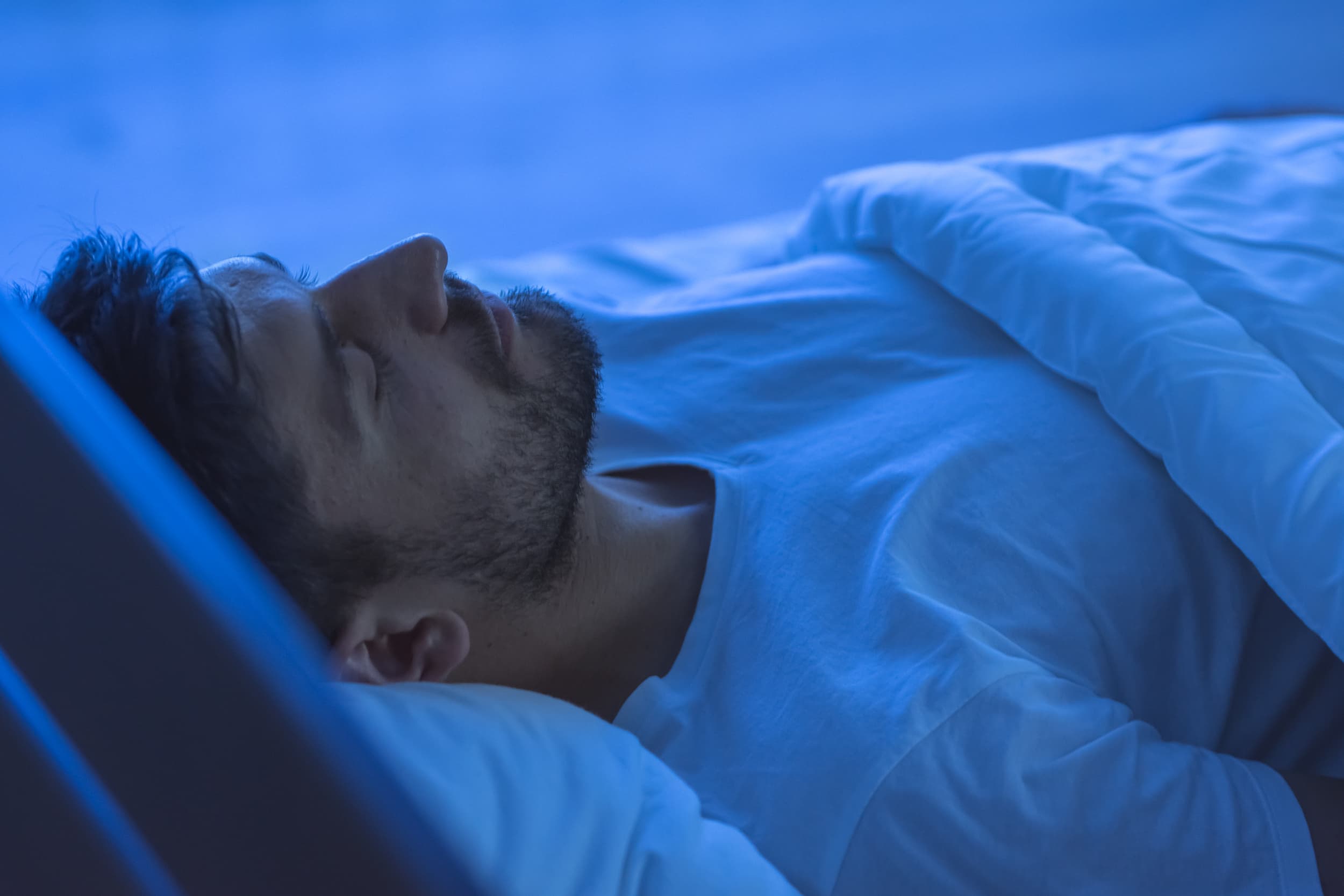 A man sleeping in his Leesa bed
