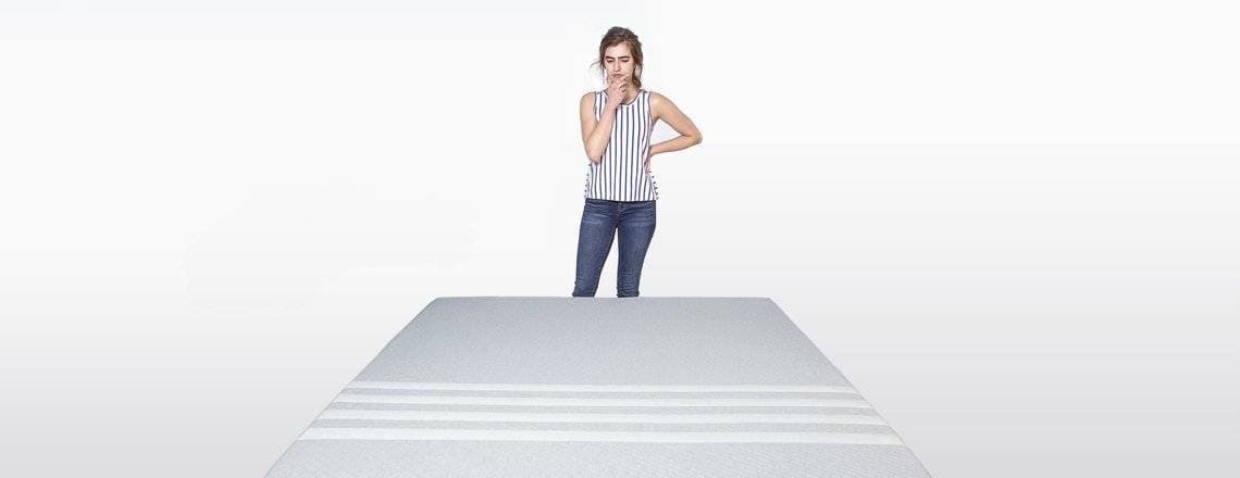 A lady pondering her Leesa mattress