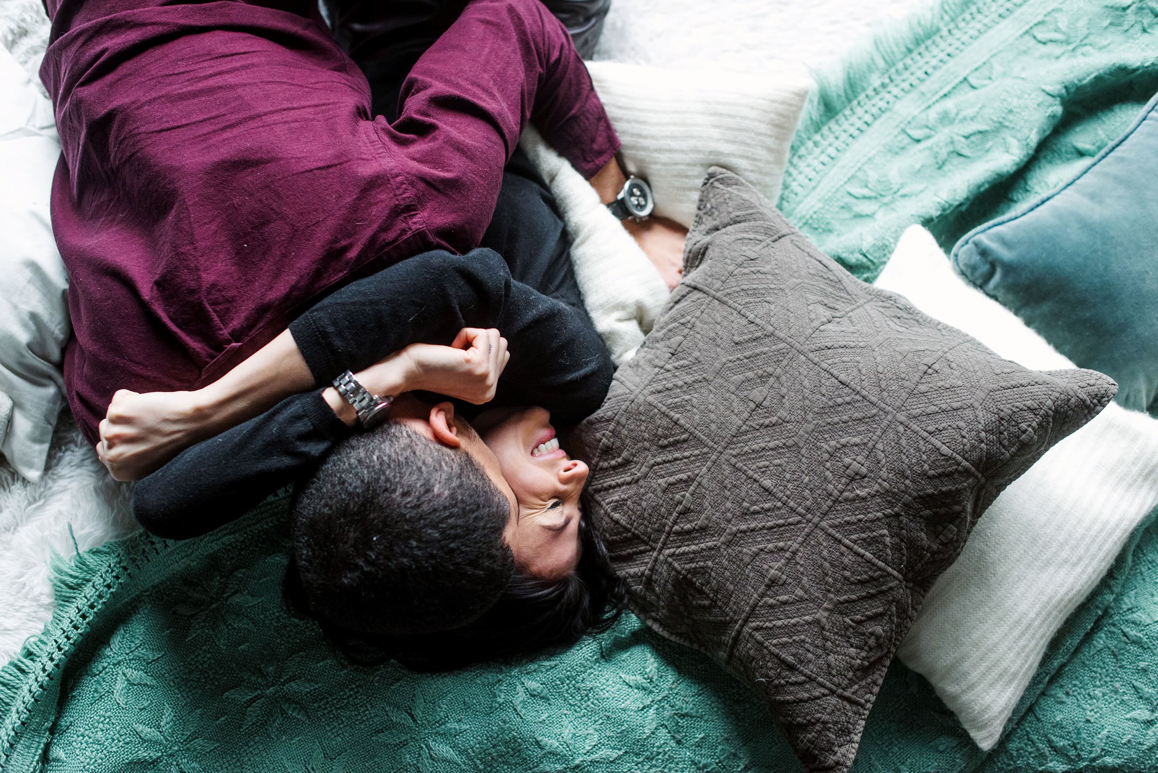 A couple cuddling on top of a Leesa bed