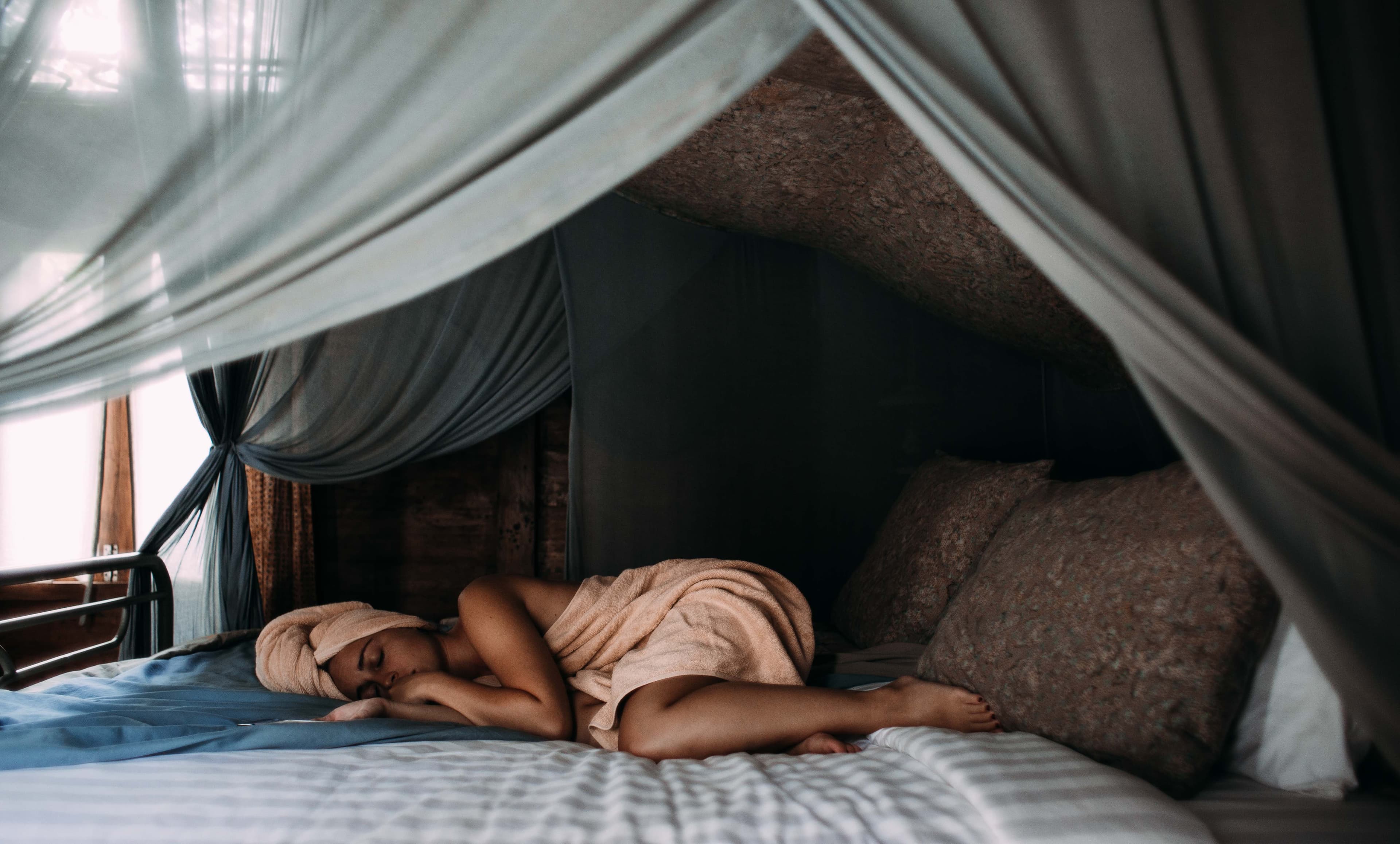 A woman sleeping on her Leesa mattress