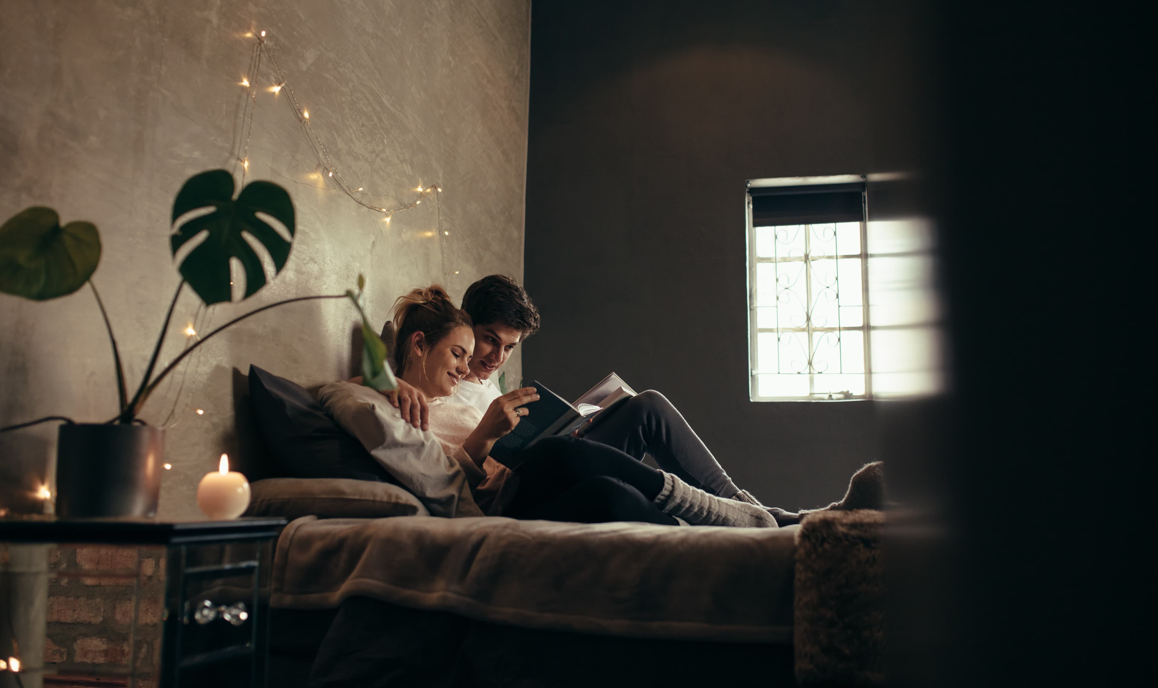 Couple reading together on a Leesa bed
